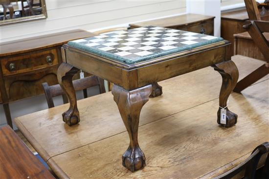 A marble top chessboard on a claw and ball feet base W.64cm